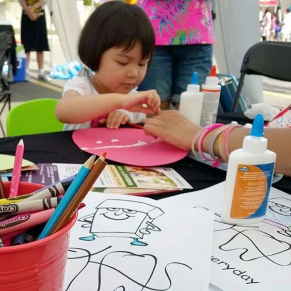 Children completing colouring pages